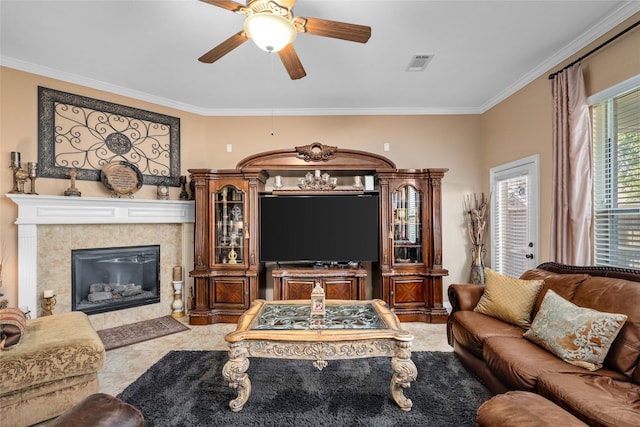 living room with a fireplace, ceiling fan, and crown molding