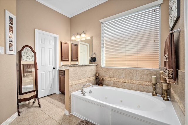 bathroom with tile patterned flooring, a tub, crown molding, and vanity