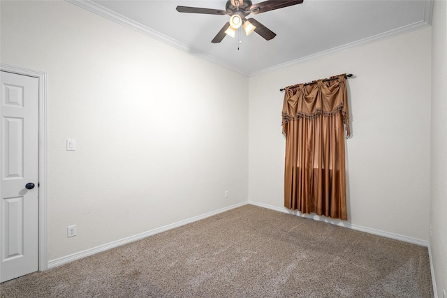 carpeted spare room featuring ornamental molding and ceiling fan