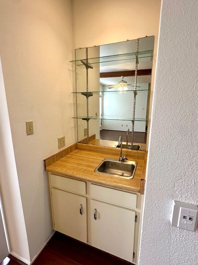 bathroom with ceiling fan and vanity