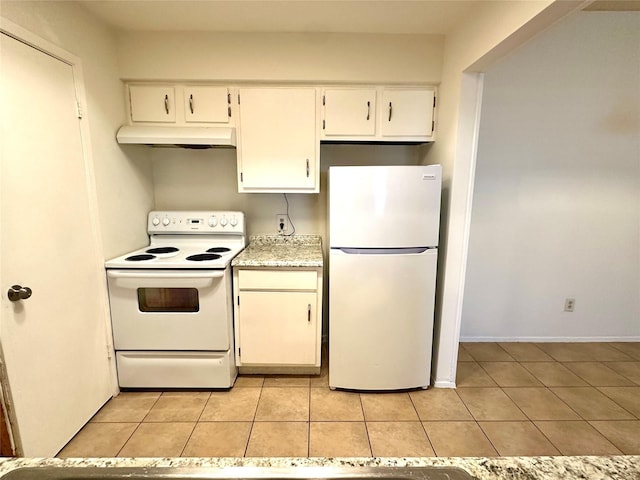 kitchen with white cabinetry, light tile patterned floors, and white appliances