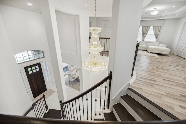 entrance foyer featuring hardwood / wood-style flooring and an inviting chandelier