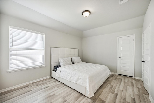 bedroom featuring light wood-type flooring