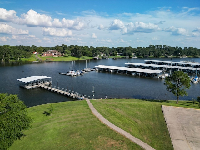 view of dock featuring a water view and a lawn