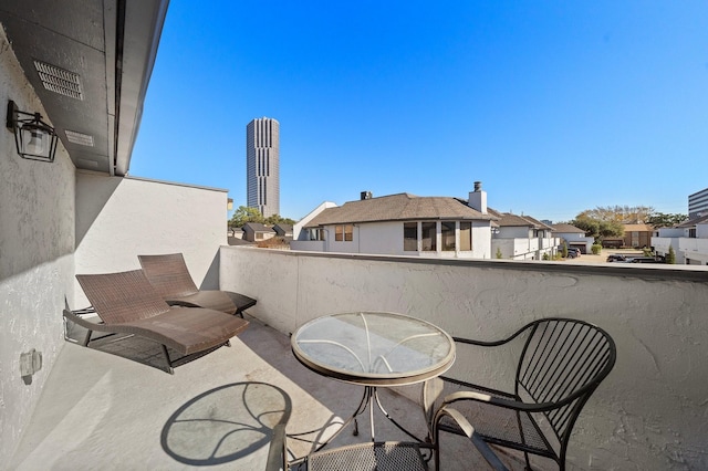 view of patio with a balcony