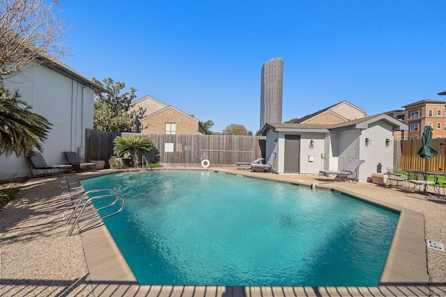 view of swimming pool featuring a patio area