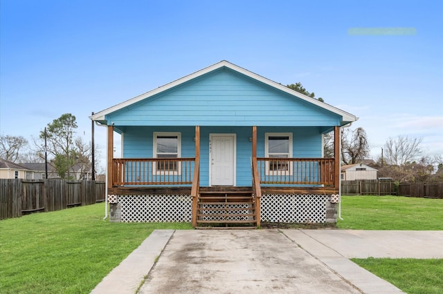 bungalow featuring a front lawn and covered porch