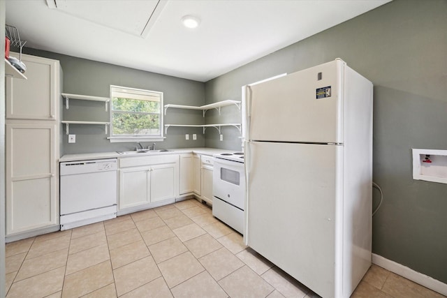 kitchen with white cabinetry, sink, white appliances, and light tile patterned floors