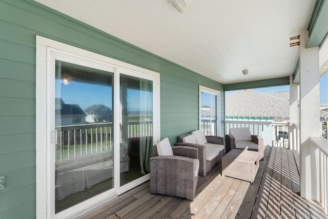 wooden deck featuring an outdoor hangout area