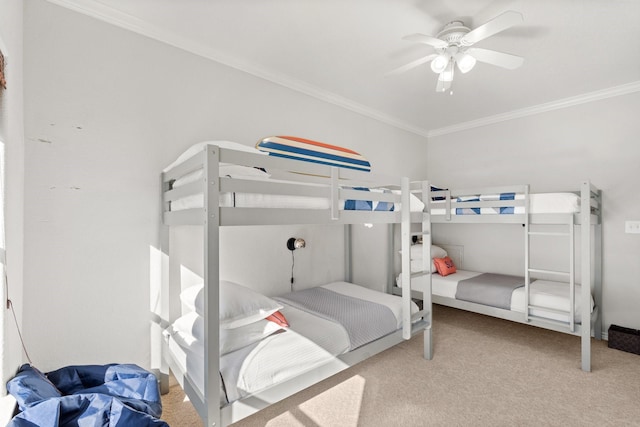 bedroom featuring ceiling fan, light colored carpet, and ornamental molding