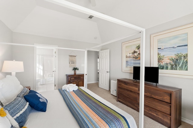 bedroom with light colored carpet, a raised ceiling, ceiling fan, connected bathroom, and lofted ceiling