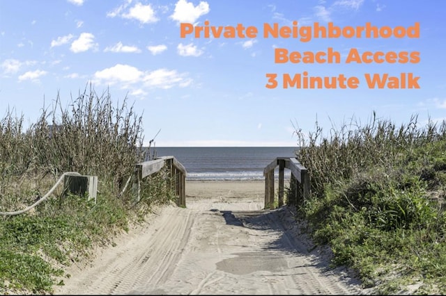 exterior space featuring a view of the beach and a water view