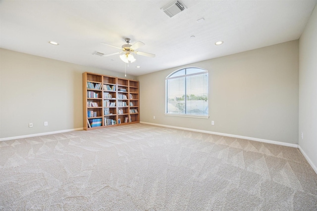 empty room with light carpet and ceiling fan