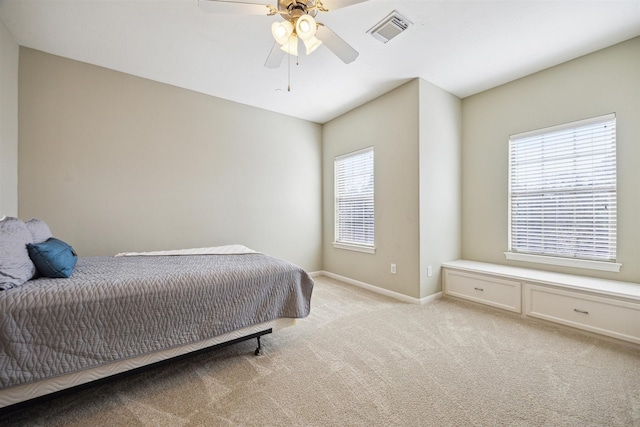 bedroom featuring ceiling fan and light colored carpet