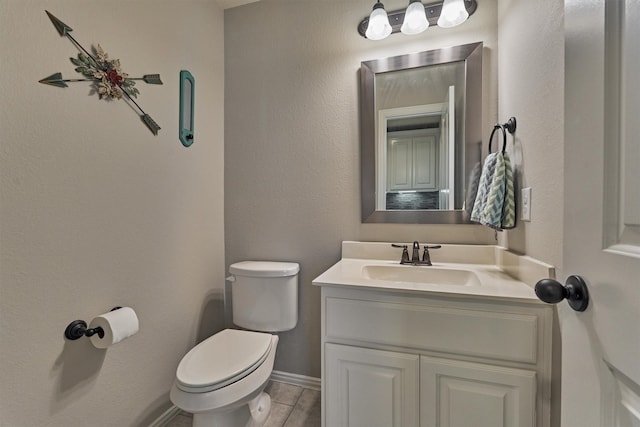 bathroom featuring hardwood / wood-style flooring, vanity, and toilet