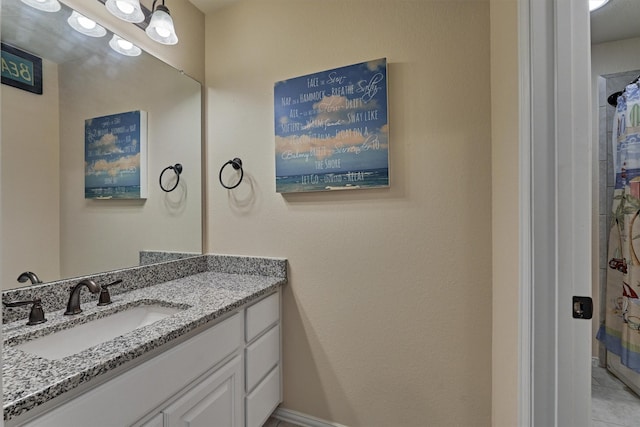 bathroom with tile patterned flooring and vanity