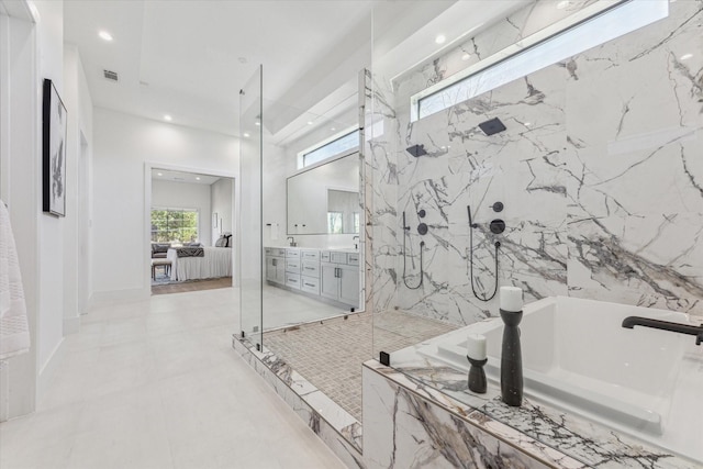 bathroom featuring vanity and plus walk in shower