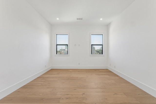 spare room featuring light wood-type flooring