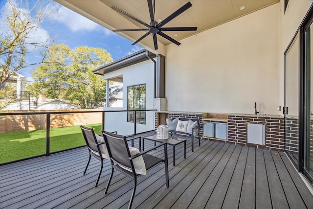 wooden terrace featuring ceiling fan