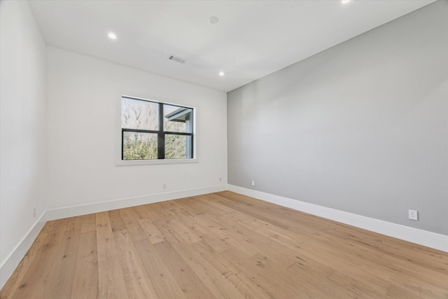 unfurnished room featuring light wood-type flooring