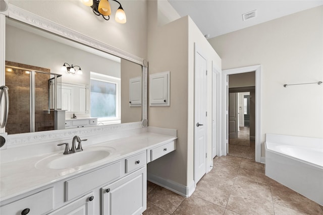 bathroom with independent shower and bath, tile patterned floors, and vanity