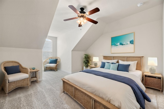 carpeted bedroom with ceiling fan and vaulted ceiling