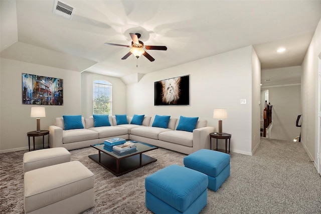 carpeted living room with ceiling fan