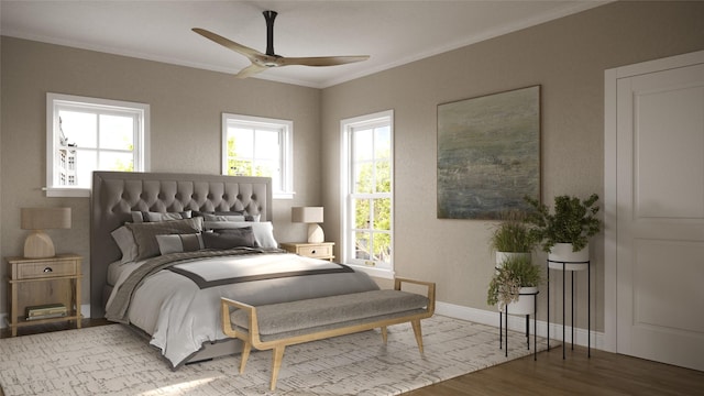 bedroom featuring hardwood / wood-style floors, ceiling fan, and crown molding