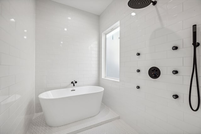 bathroom featuring tile walls, tile patterned flooring, plenty of natural light, and shower with separate bathtub