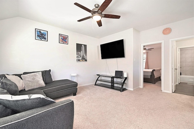 living room with carpet, ceiling fan, and lofted ceiling