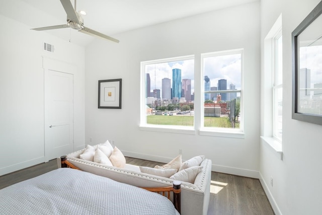 bedroom featuring ceiling fan and dark wood-type flooring