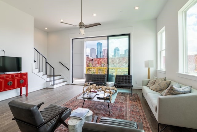 living room with hardwood / wood-style flooring and ceiling fan