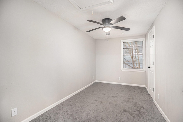 carpeted empty room featuring a textured ceiling and ceiling fan