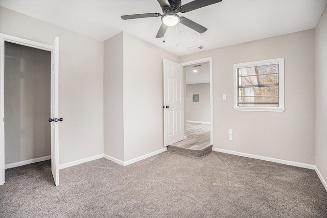 unfurnished bedroom with carpet and ceiling fan