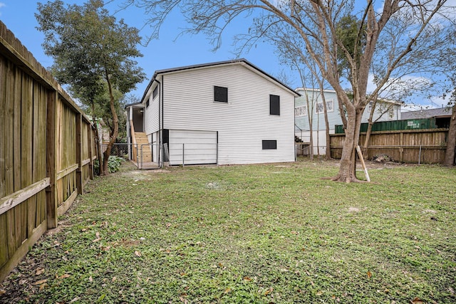 back of house with a yard