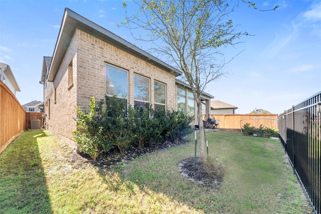 view of property exterior featuring a yard and cooling unit