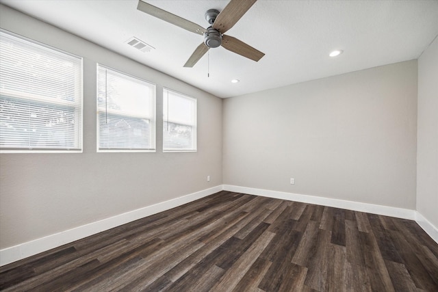 empty room featuring dark hardwood / wood-style floors and ceiling fan