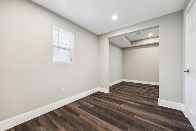 basement featuring dark hardwood / wood-style flooring