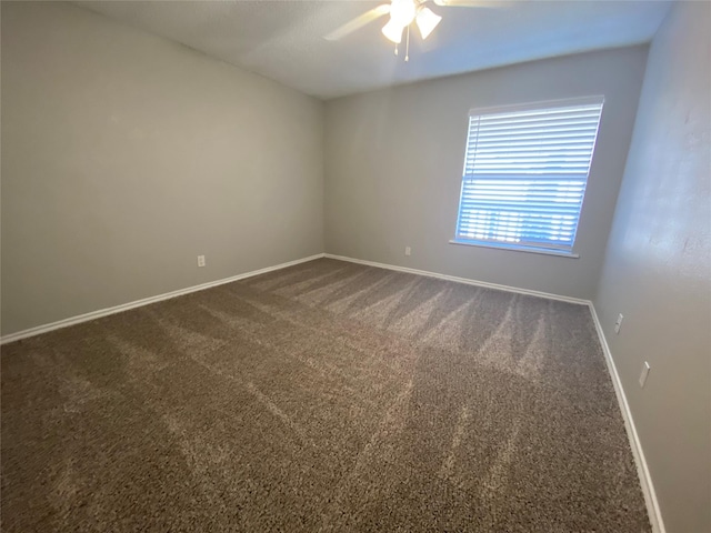 unfurnished room with carpet flooring and ceiling fan