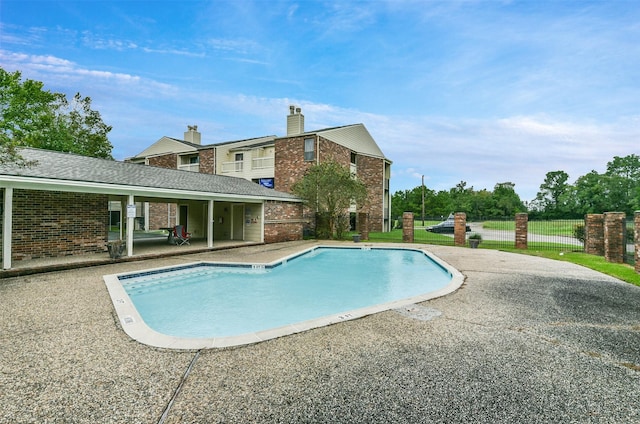 view of swimming pool featuring a patio area