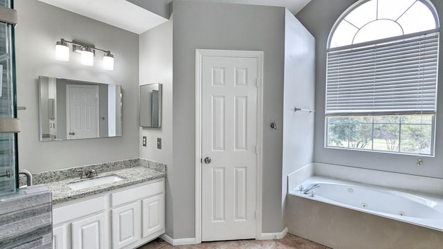 bathroom featuring plenty of natural light, vanity, and shower with separate bathtub