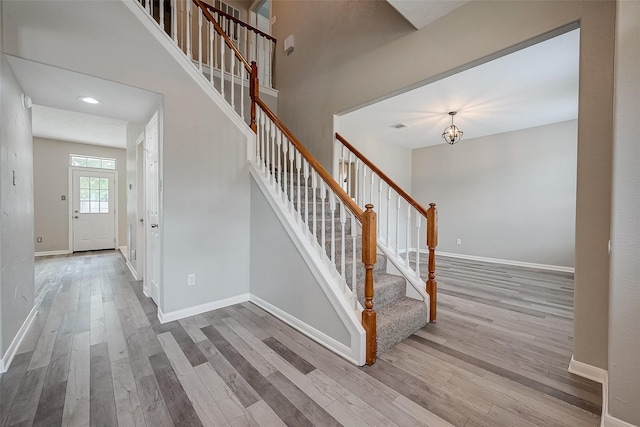 staircase featuring hardwood / wood-style flooring