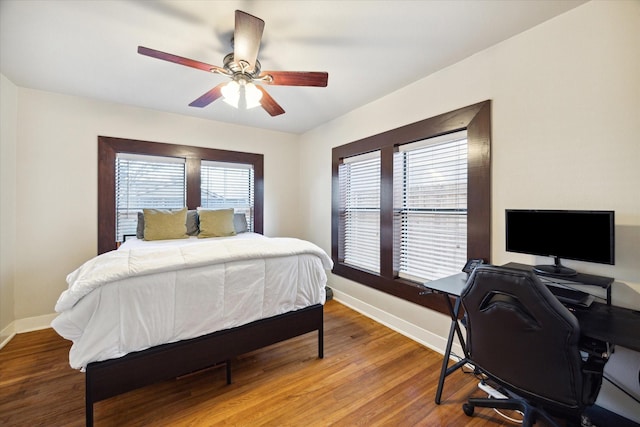 bedroom featuring ceiling fan and hardwood / wood-style flooring