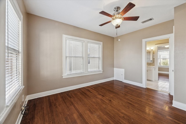 unfurnished bedroom with ceiling fan, dark hardwood / wood-style flooring, and ensuite bathroom