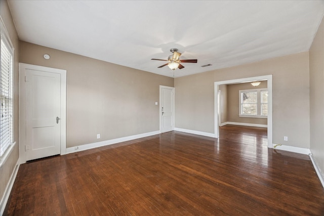 unfurnished room featuring dark hardwood / wood-style flooring, plenty of natural light, and ceiling fan