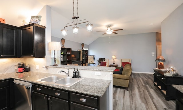 kitchen with kitchen peninsula, ceiling fan, sink, decorative light fixtures, and dishwasher