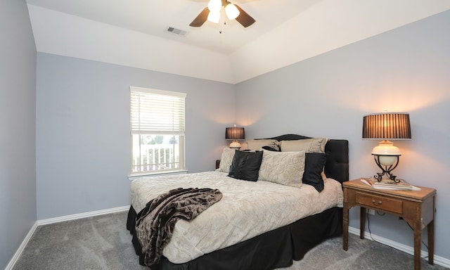 bedroom with ceiling fan, carpet floors, and vaulted ceiling