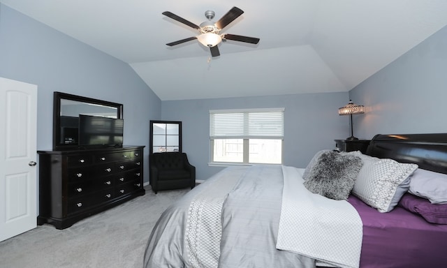 bedroom featuring ceiling fan, light colored carpet, and vaulted ceiling