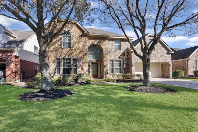 view of front of house featuring a garage and a front lawn