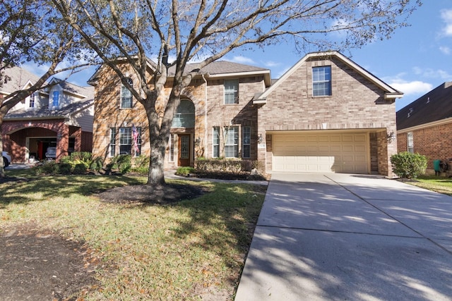 view of front of house featuring a garage and a front lawn